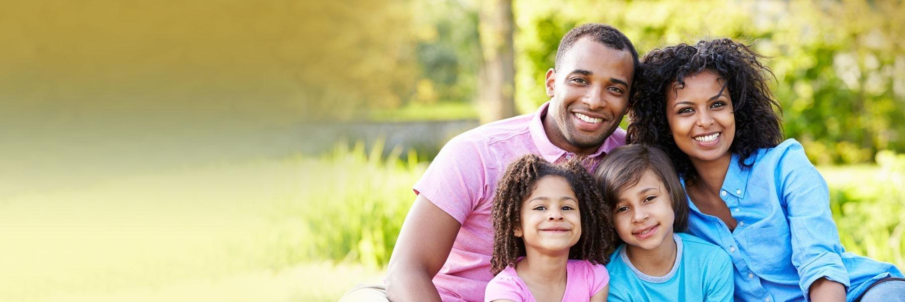 Young family relaxing together after general dentistry in Edina, MN