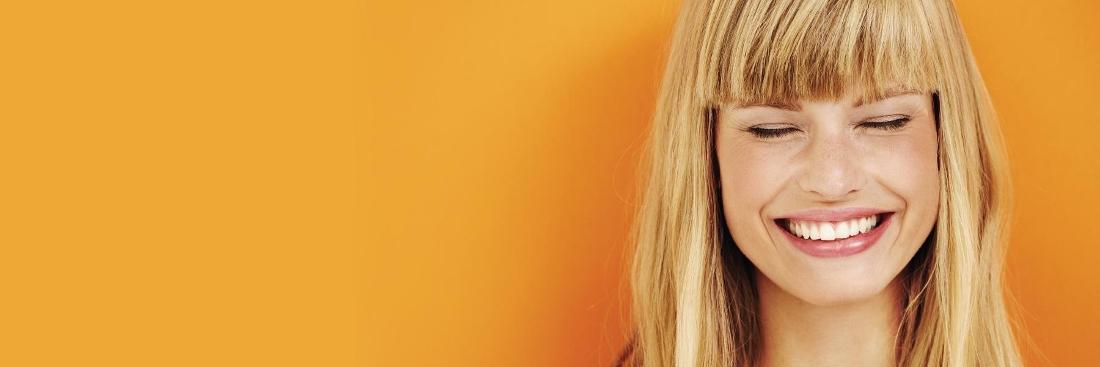 Woman smiling after smile makeover in Edina, MN