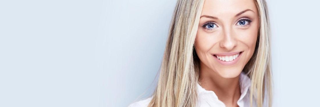 Woman smiling after dental treatment in Edina, MN