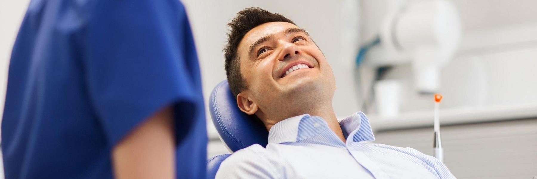 Man smiling during dental cleaning in Edina, MN
