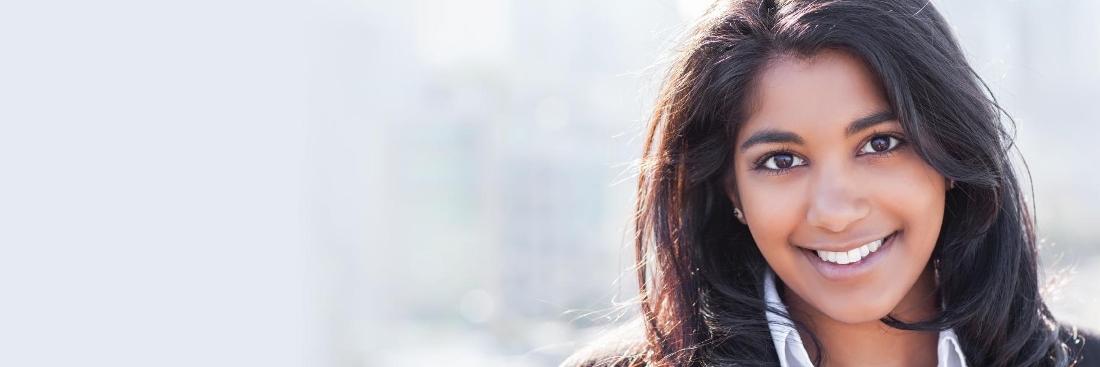 Woman smiling afterTeeth Whitening at 50th and France Dental Care