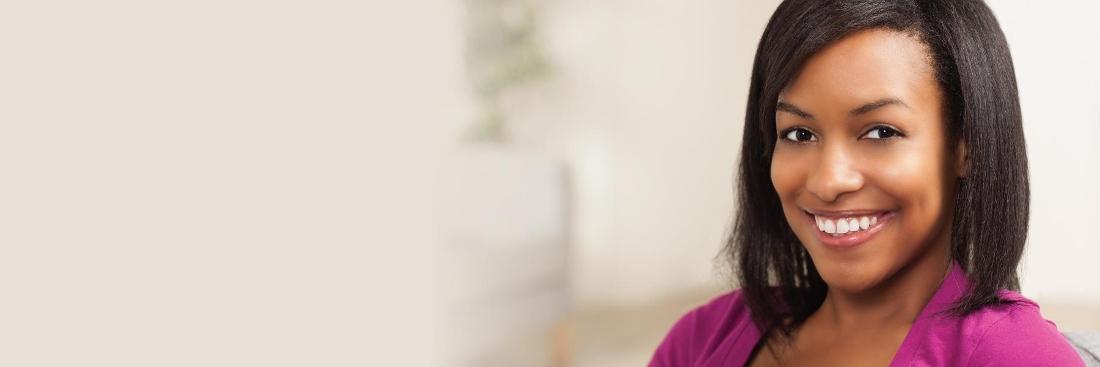 Woman smiling after getting dental crowns inEdina, MN