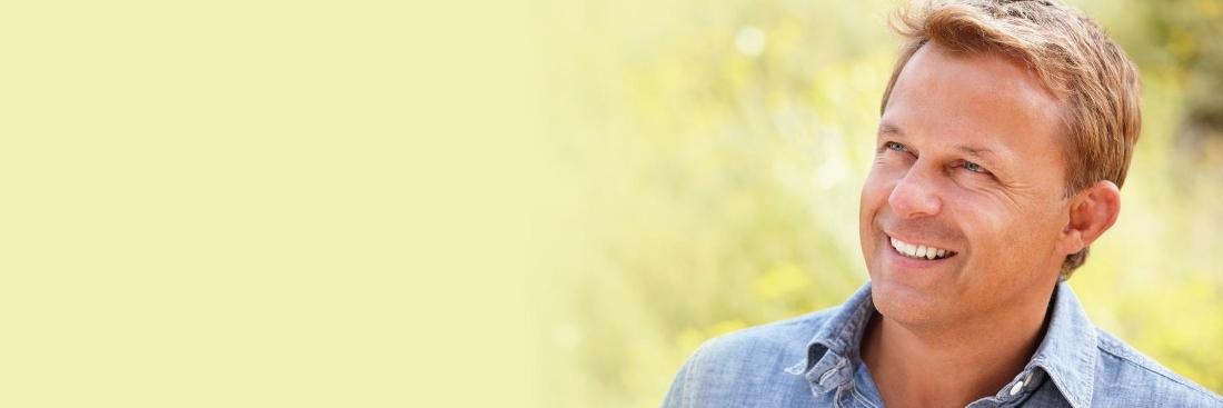 Man smiling after getting dental crowns in Edina, MN