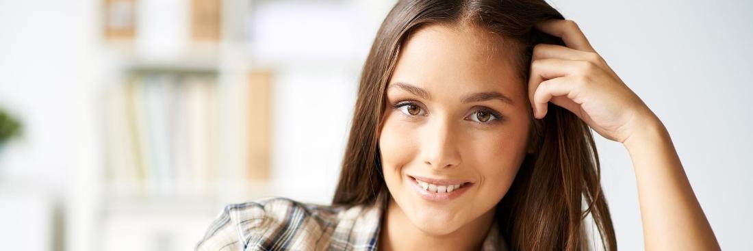 Woman smiling after dental treatment in Edina, MN