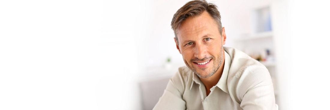 Man smiling after getting dental implants in Edina, MN