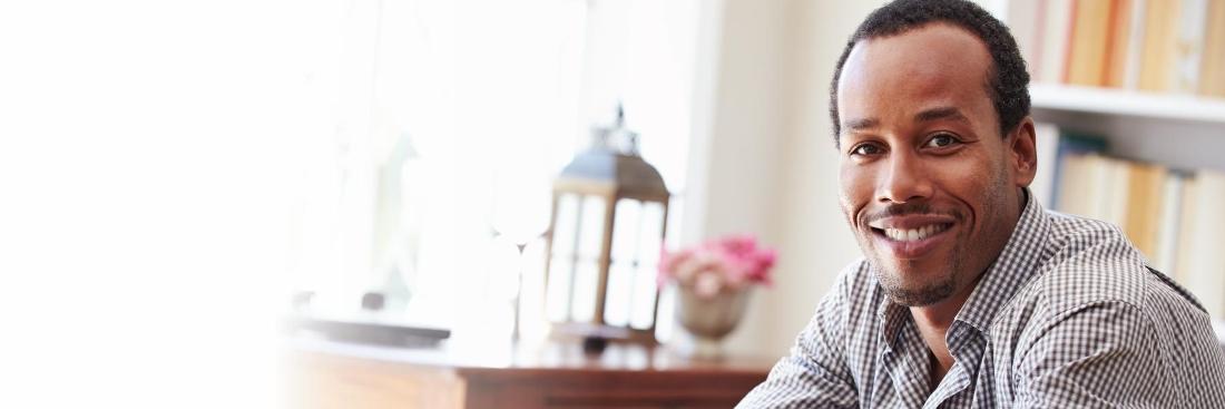 Man smiling before dental examination in Edina, MN