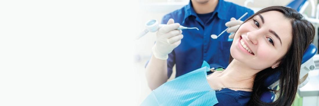 Woman smiling in dental during dental cleaning in Edina, MN