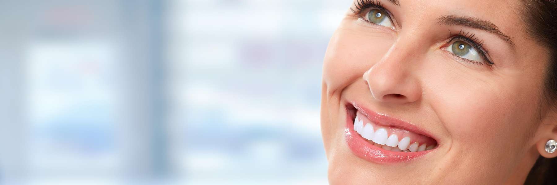 Woman smiling after cosmetic dentistry session in Edina, MN