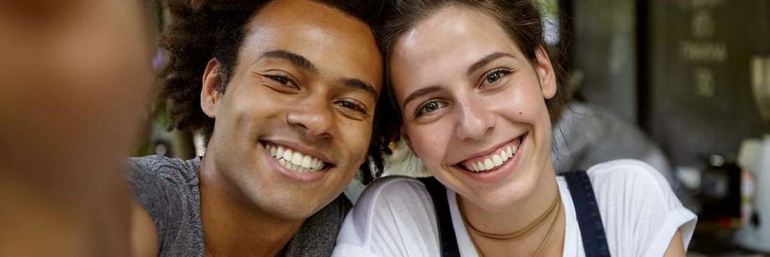 Friends smiling after getting dental implants in Edina, MN