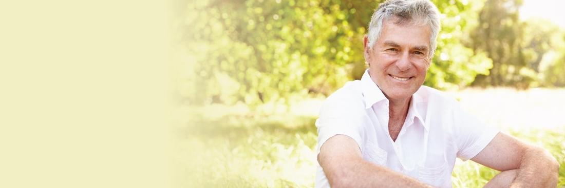 Man smiling after getting dental implants in Edina, MN