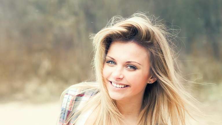 A woman with Precisely Placing Implants in Edina, MN