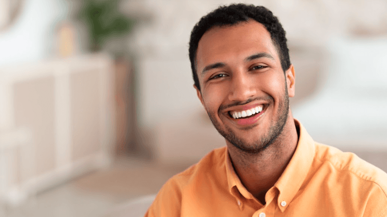 Man smiling after getting dental crowns in Edina, MN