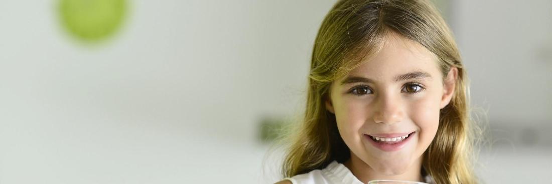 Small girl smiling after dental check up at t 50th and France Dental Care