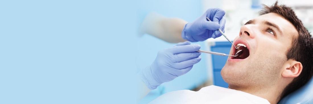 Man getting dental examination in Edina, MN