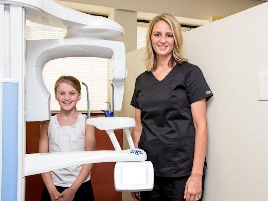 image of patient getting ready for an xray with 50th & France Dental Care's state of the art technology