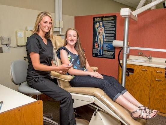 Image of Registered Dental Hygienist Tracy in the 50th & France Dental Care operatory 